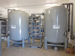 Two activated carbon vessels with a lead/lag piping header and slurry changeout lines are installed to remove BTEX from a pipeline cleanup project