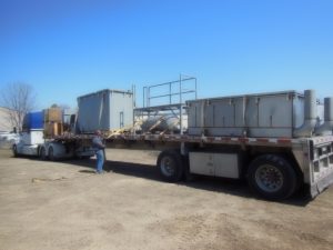 Air stripper, oil-water separator, and other water treatment equipment shipping on a flatbed
