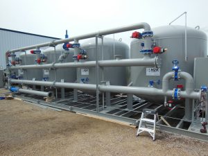 A set of pressure vessels with welded steel self-source backwash piping header
